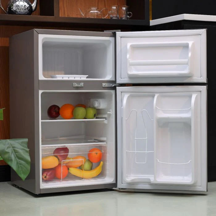 Geepas GRF1259GPE 84L Double Door Defrost Refrigerator – Rapid Cooling | Tempered Glass Shelves | CFC-Free